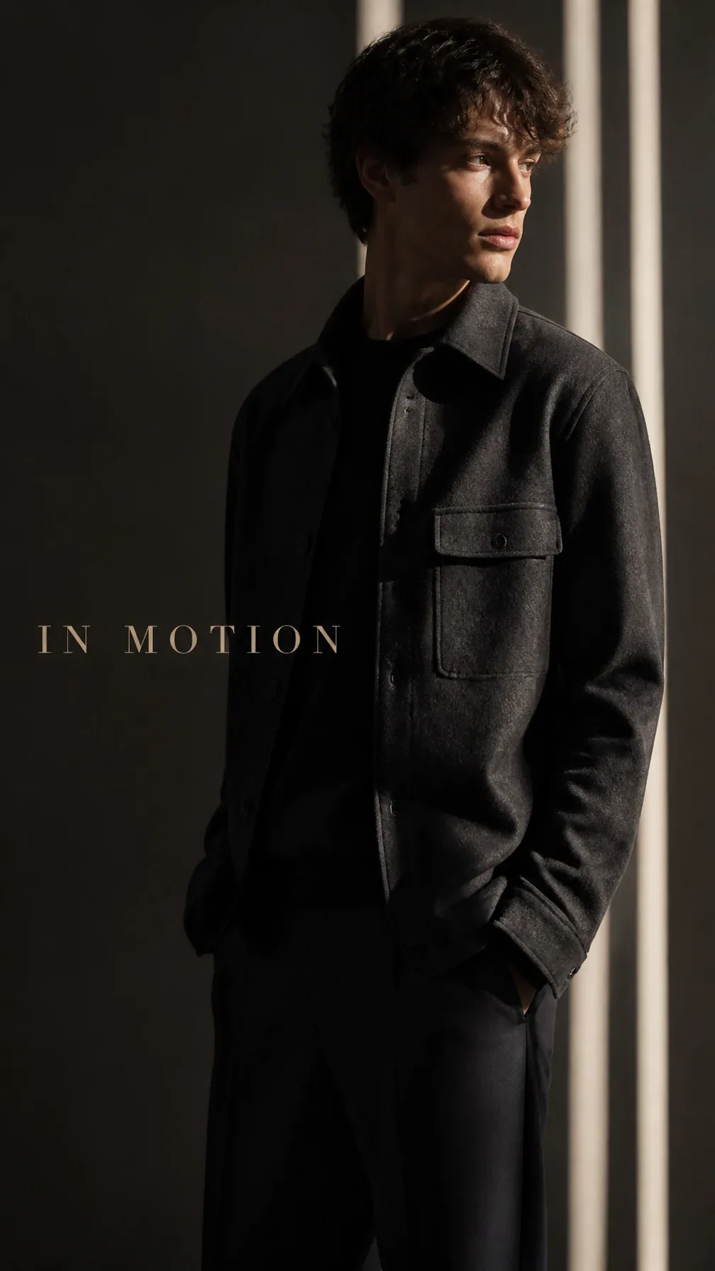 Luxury fashion editorial. Main Subject: Young male model wearing a charcoal overshirt. Creative Direction: Fi… - AI prompt reference from CC Prompt Galaxy