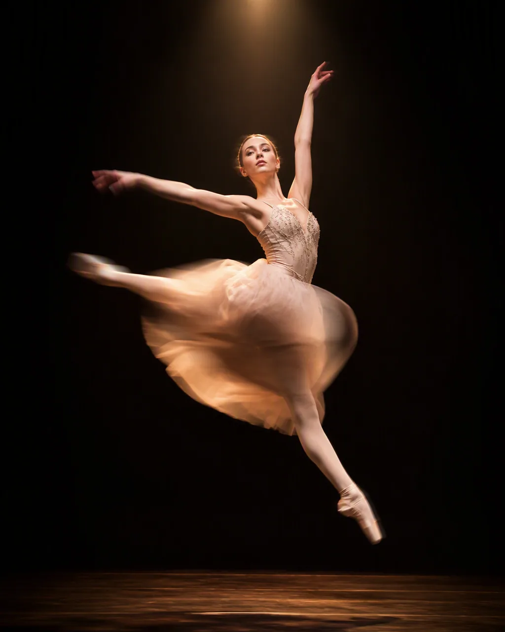 SUBJECT: a young ballet dancer mid-leap on a dark stage, face and upper body perfectly sharp, arms and tutu t… - AI prompt reference from CC Prompt Galaxy