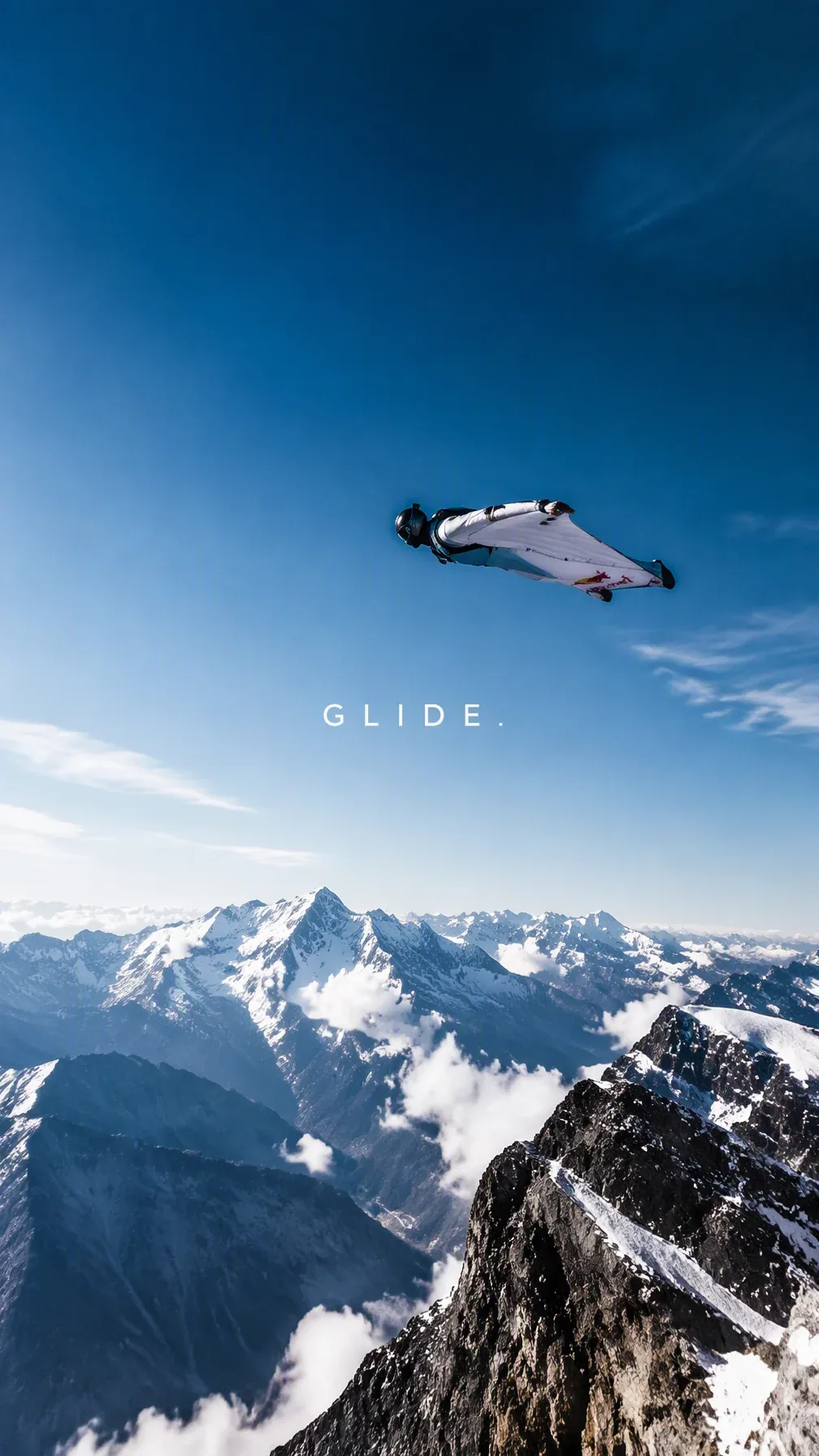 Create a premium 9:16 sports editorial.Main Subject:Young male wingsuit athlete gliding above a mountain ridg… - AI提示词参考图，来自西西提示词