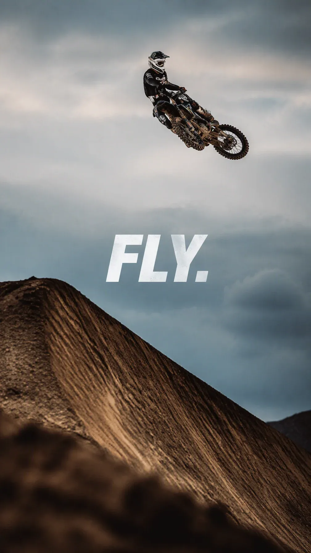 Create a premium 9:16 action-sports editorial.Main Subject: Young male motocross rider suspended high above a… - AI prompt reference from CC Prompt Galaxy