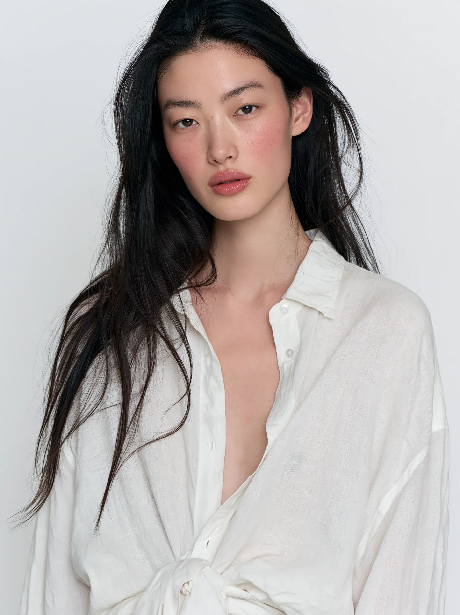 portrait of an Enst Asian female model with long black hair, soft pink blush makeup and glossy lips, head til… - AI提示词参考图，来自西西提示词