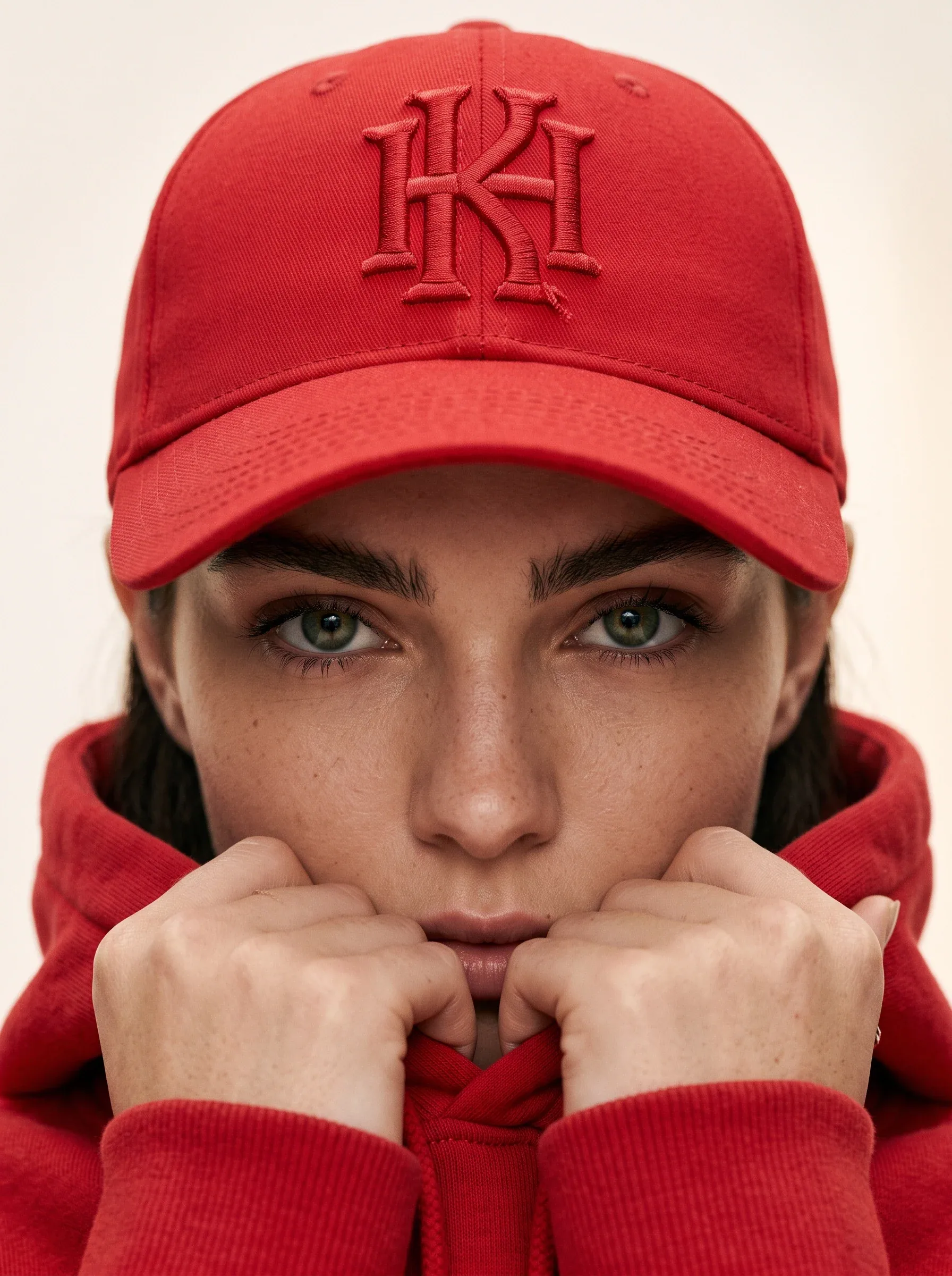 Ultra-realistic fashion beauty crop of a female model wearing the reference red baseball cap and matching red… - AI prompt reference from CC Prompt Galaxy