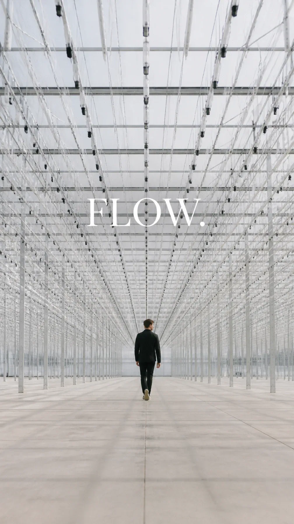 Premium editorial campaign. Main Subject: Young man walking through an enormous empty greenhouse corridor. Cr… - AI提示词参考图，来自西西提示词