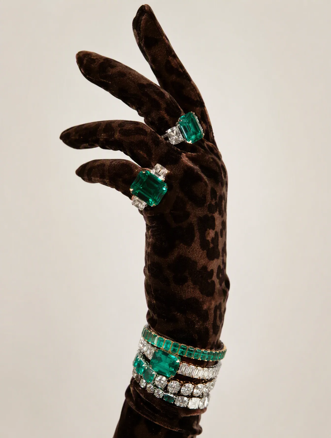Luxury studio photograph of a feminine hand wearing a deep brown velvet glove with subtle leopard patterning,… - AI提示词参考图，来自西西提示词
