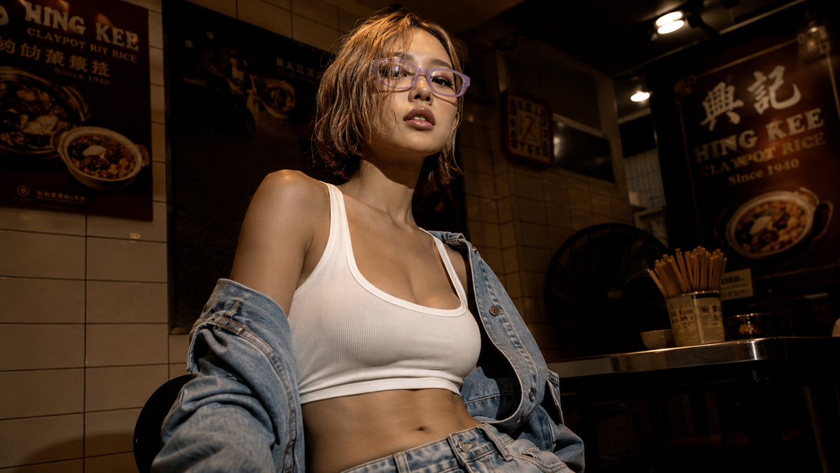 Create a cinematic low-angle wide portrait of a confident young East Asian woman seated in a dim Hong Kong-st… - AI提示词参考图，来自西西提示词