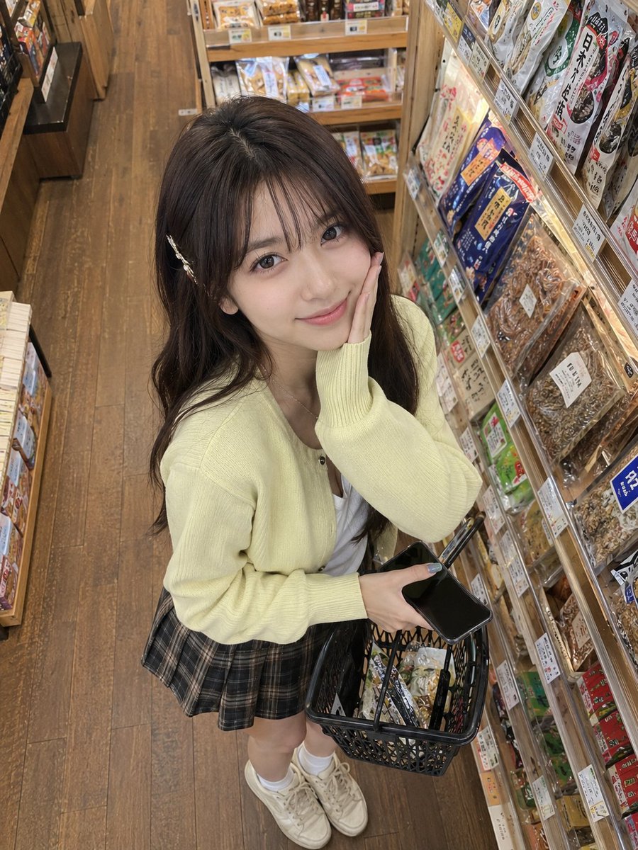 Ultra-realistic candid lifestyle photograph of a young East Asian woman shopping in a cozy Japanese grocery s… - AI提示词参考图，来自西西提示词
